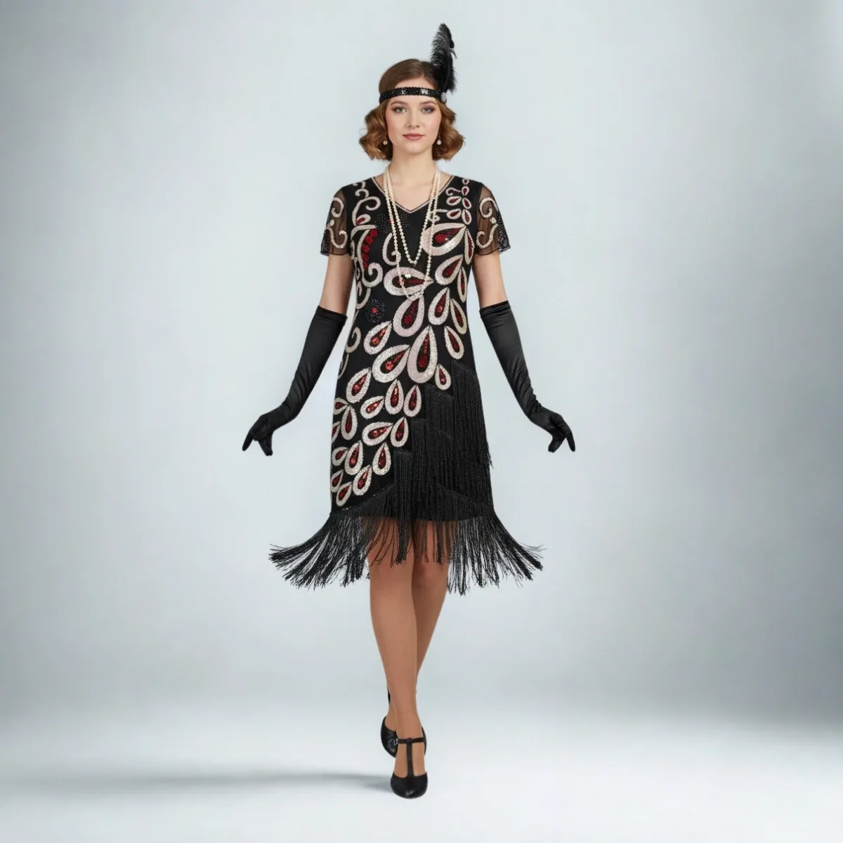 Black retro-style dress with peacock-feather motifs